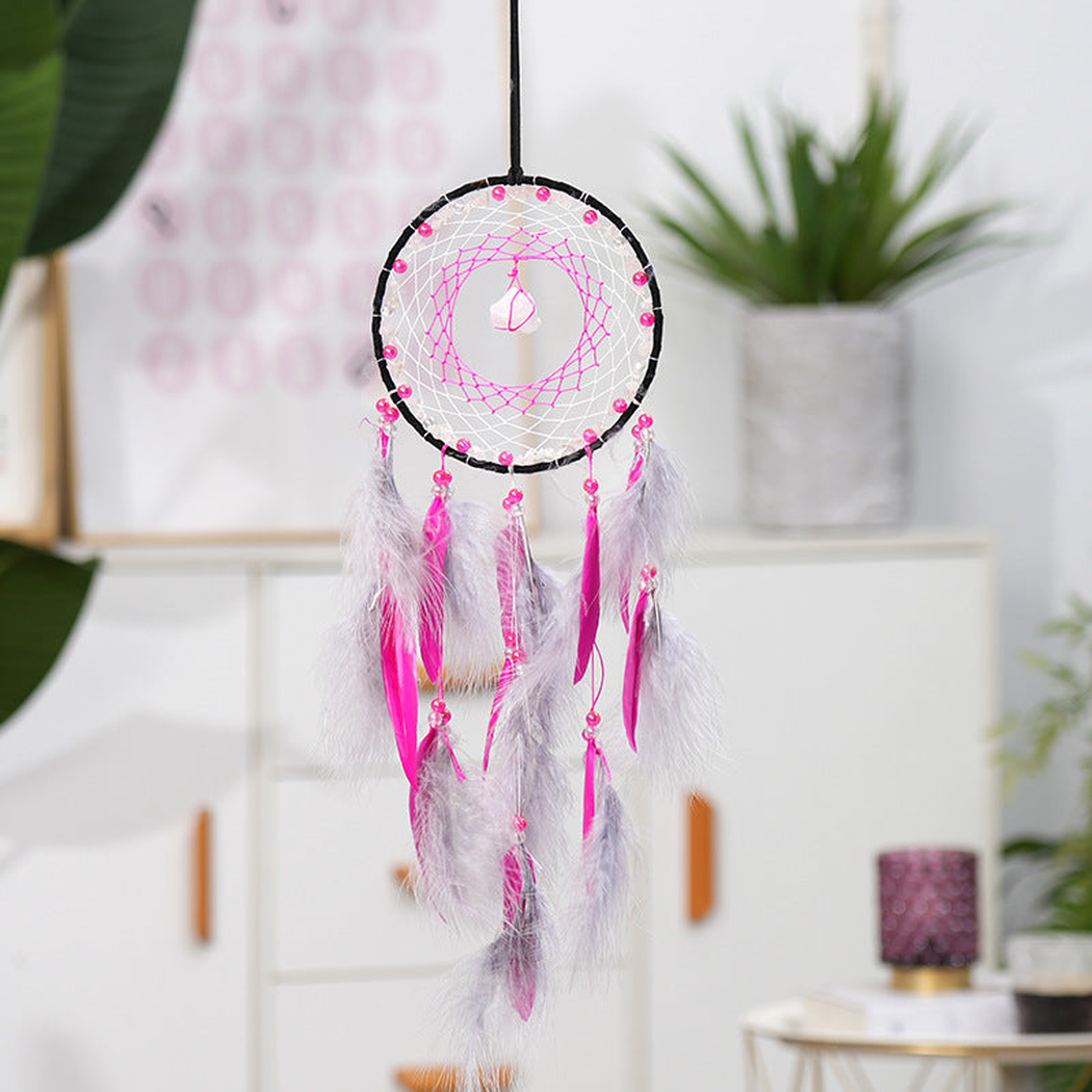 Fuchsia Dreamcatcher hanging in a bright interior setting