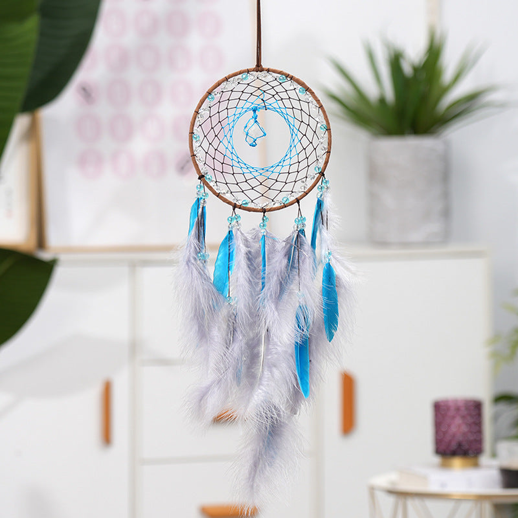 Turquoise Dreamcatcher hanging in a bright interior setting