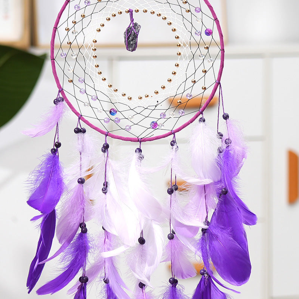 Detail of layered purple and white feather-look elements with dark bead-look accents