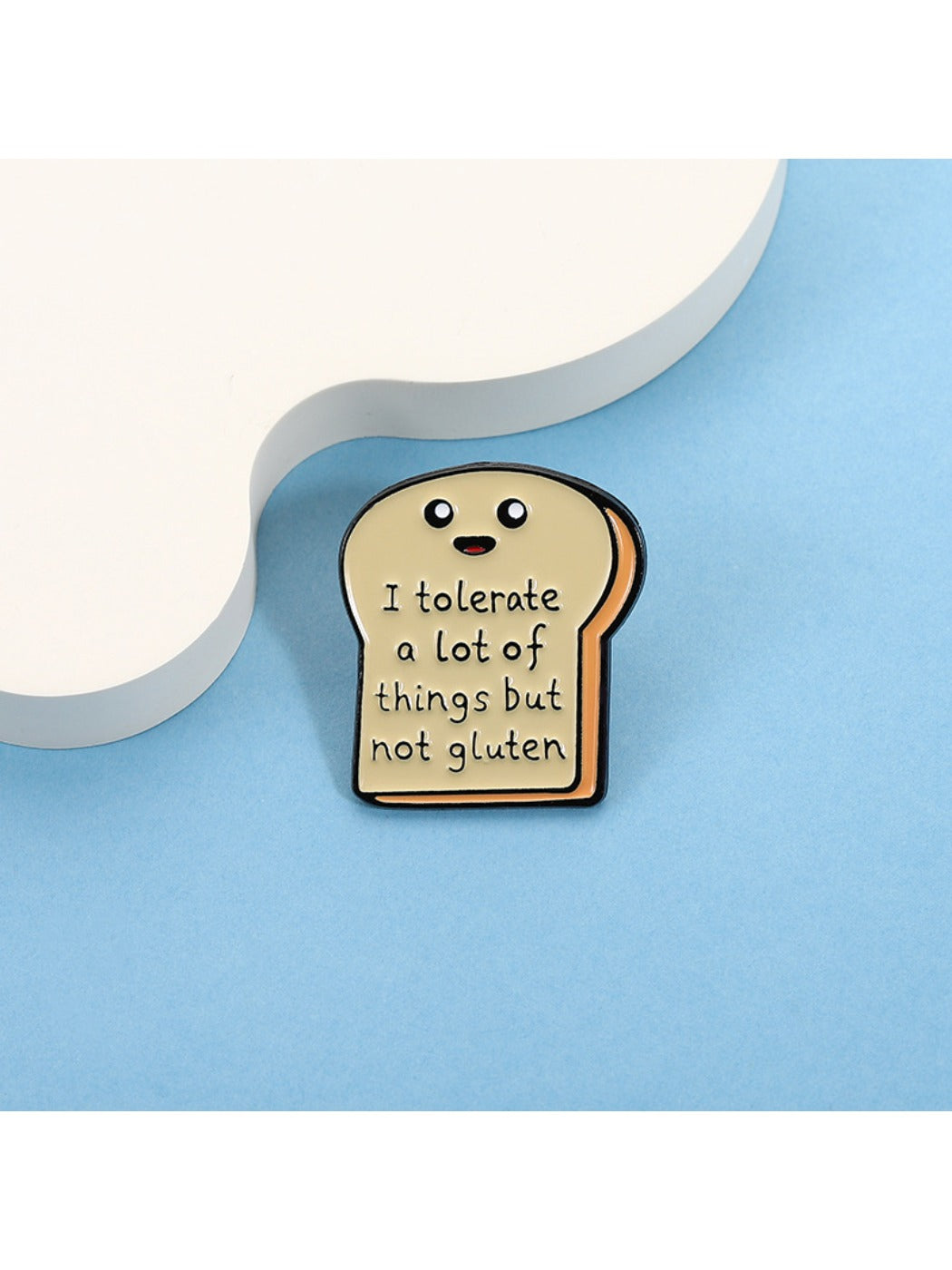 Side view of Pinori cute bread cartoon pin highlighting thickness