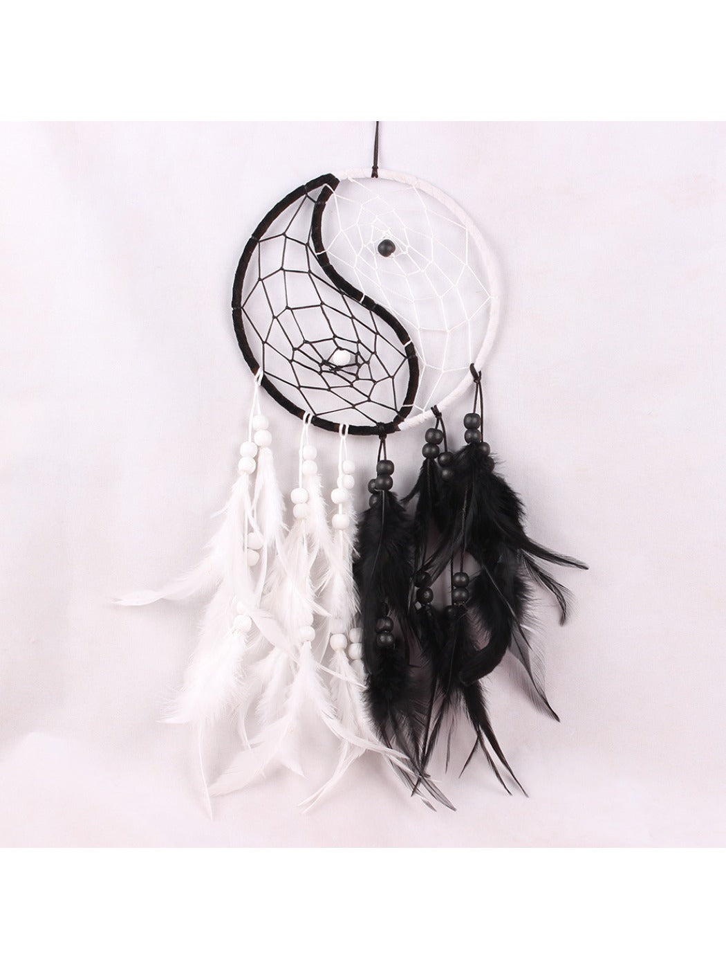 Side view of Somnira Tai Chi dreamcatcher wall art highlighting woven textures