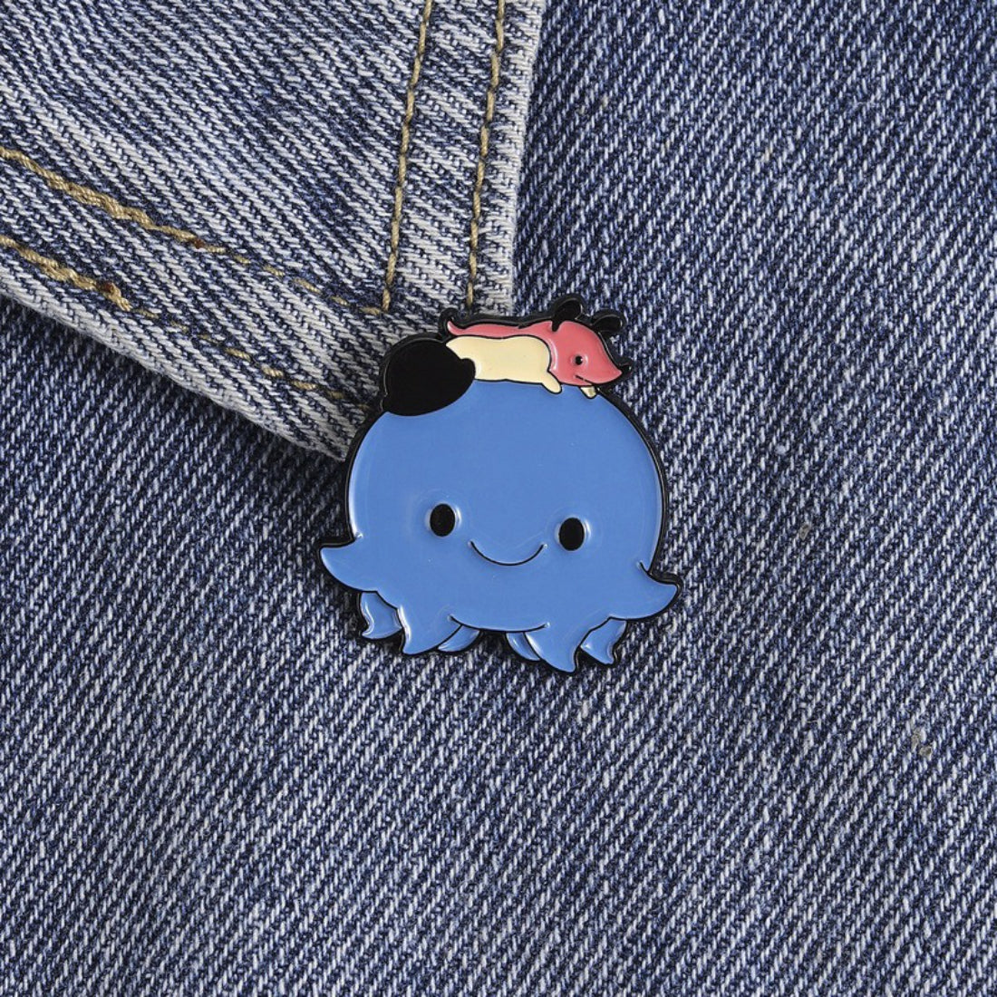 Pinori Tiny Friend Octopus Pin attached to a fabric surface as an accessory
