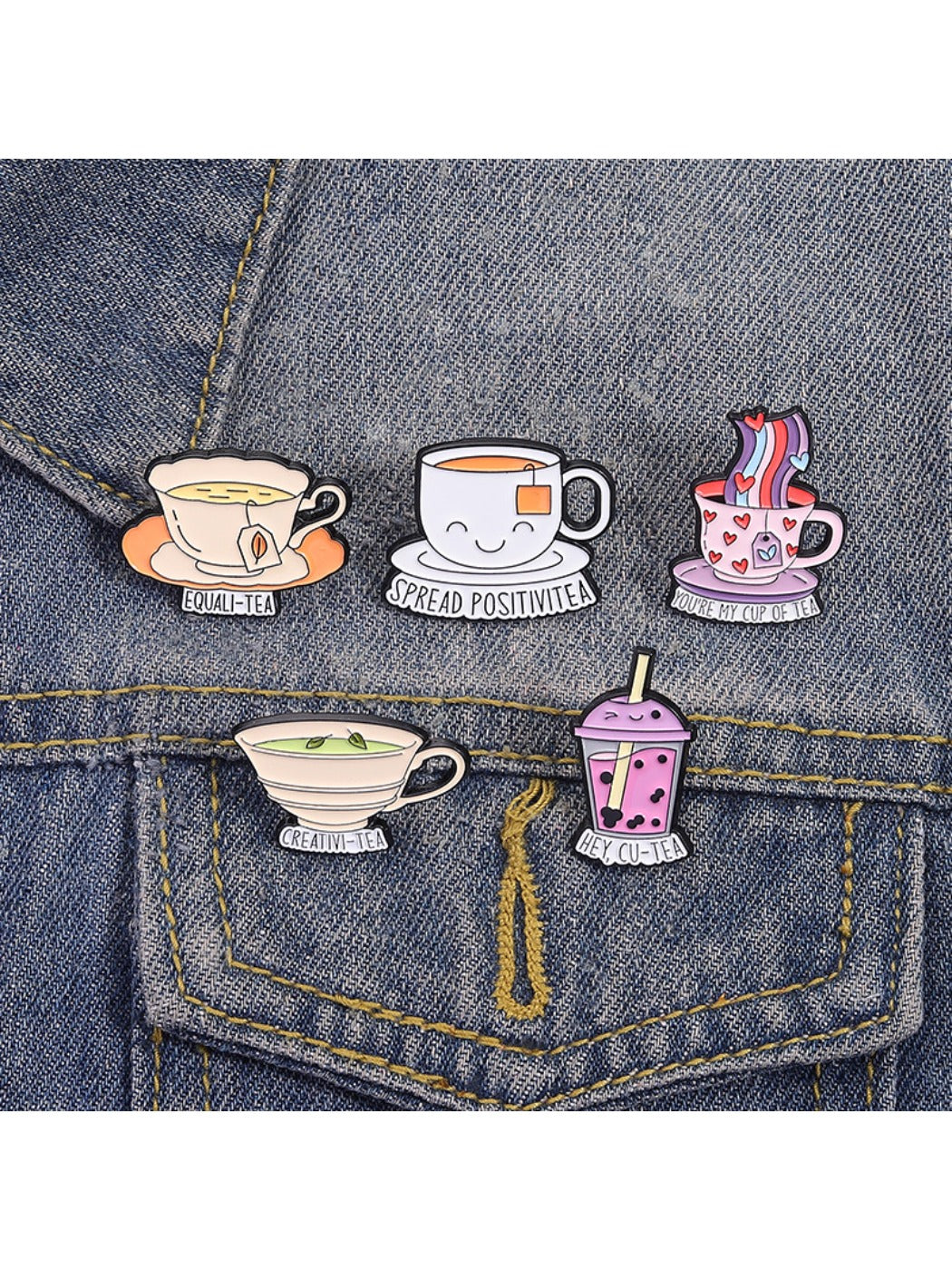 Pinori enamel pin held between fingers to show size and detail