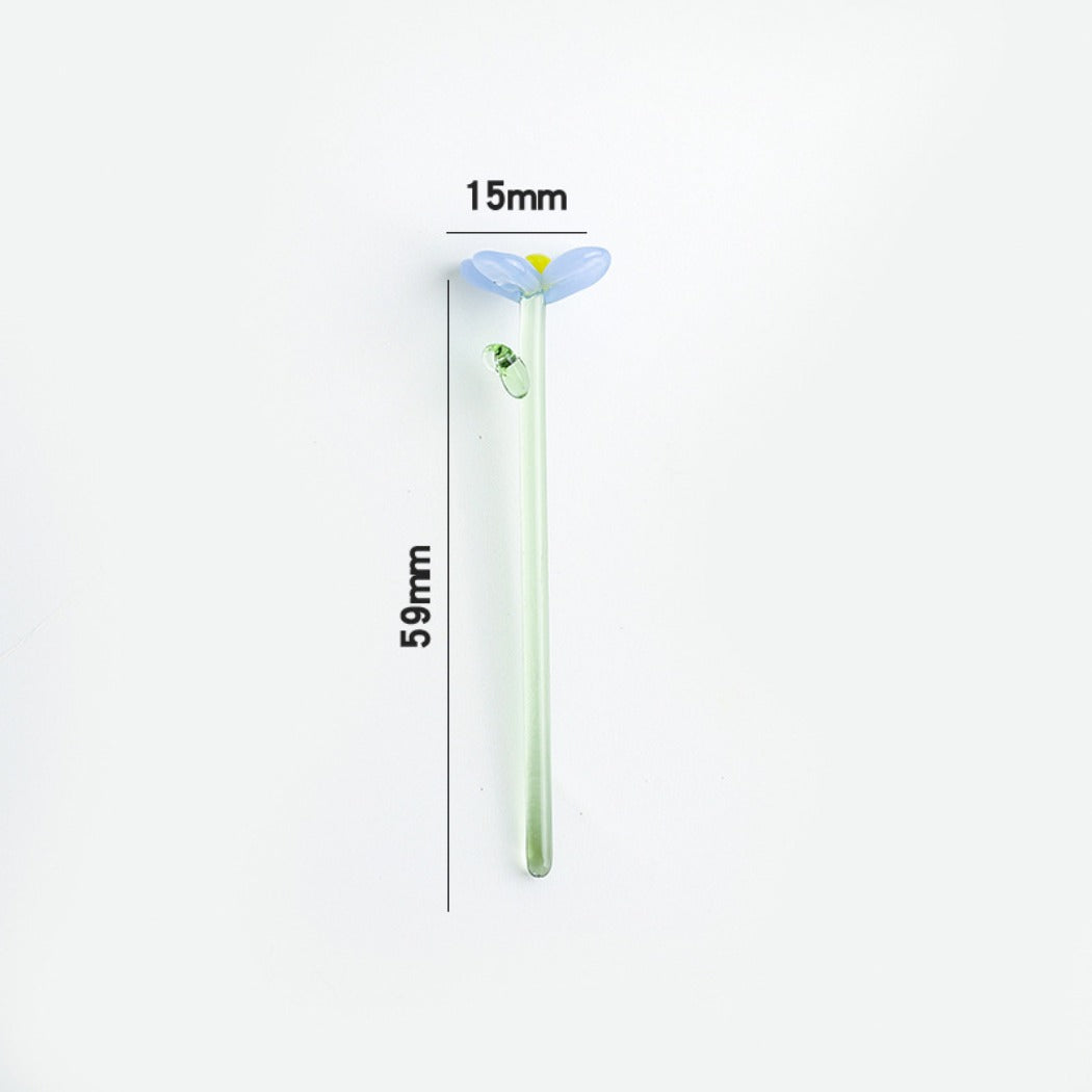 Thimara mini glass daisy displayed on a wooden surface with soft lighting
