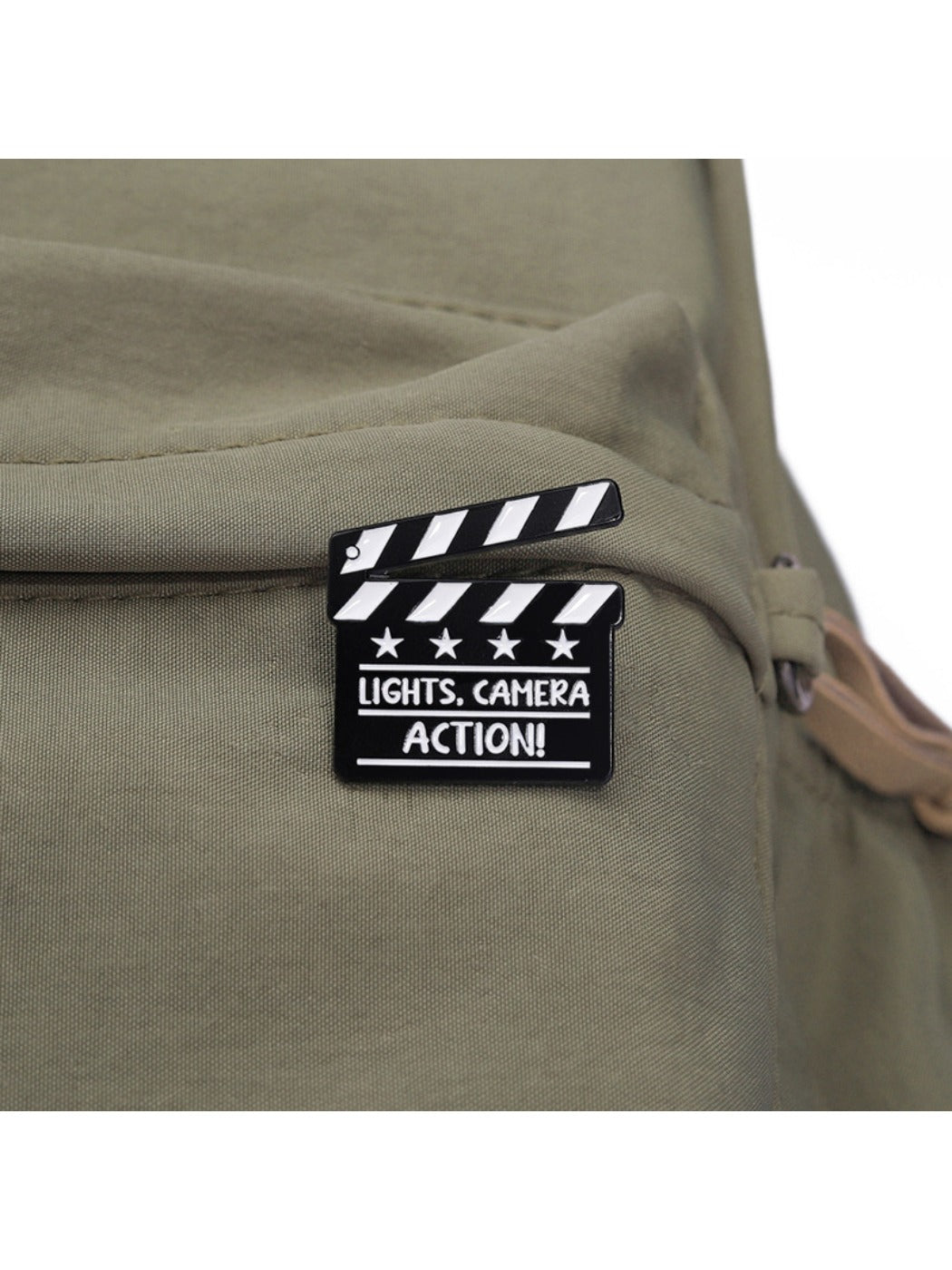 Side view of Pinori TV series clapperboard brooch highlighting thickness