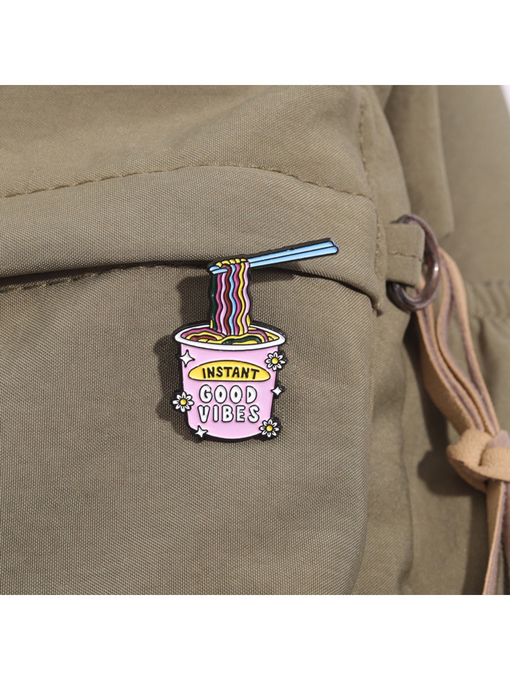 Side view of Pinori instant noodle ramen brooch pin highlighting its thickness and metal backing