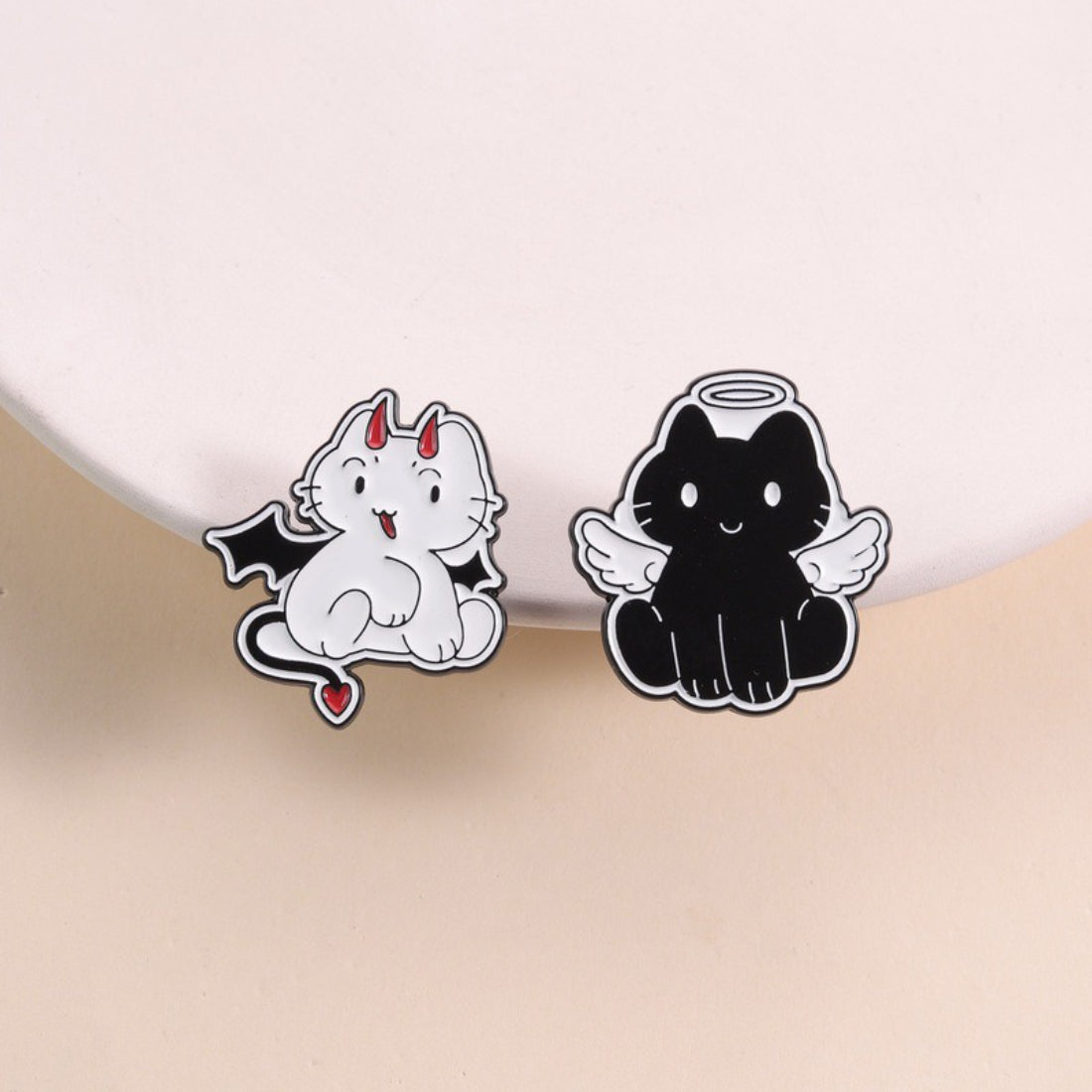 Pinori Angel Devil Cat enamel pin showing cat with angel wings and devil horns on white background