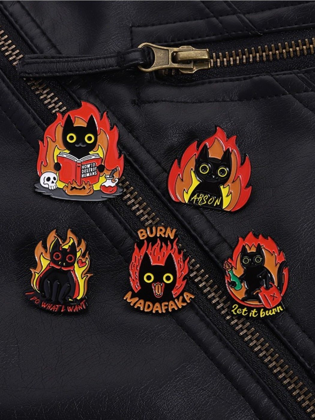 Side view of Pinori black cat flame badge highlighting enamel finish