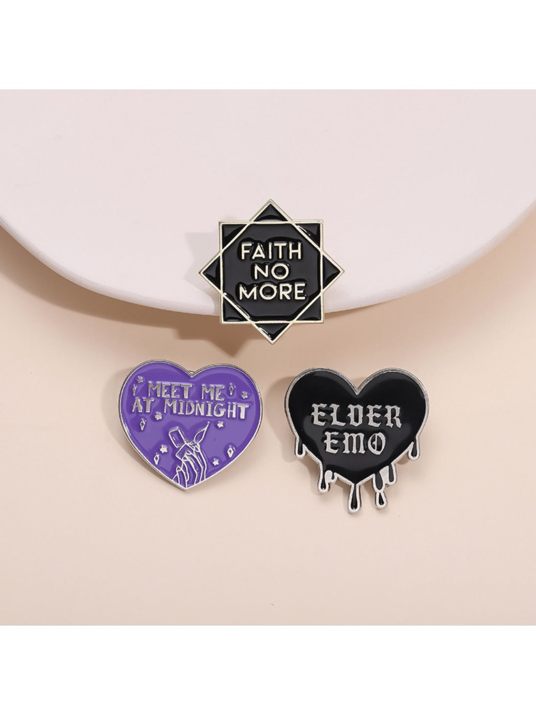 Pinori black heart rock band badge with letter design on white background