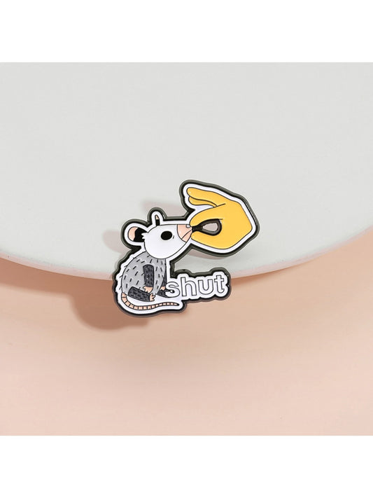 Close-up of Pinori white lab rat metal pin badge on black background