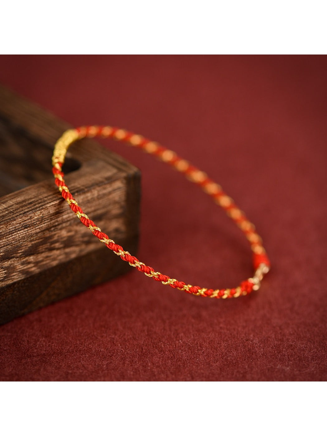 Emora Premium Vajra Knot Bracelet displayed on a wooden surface