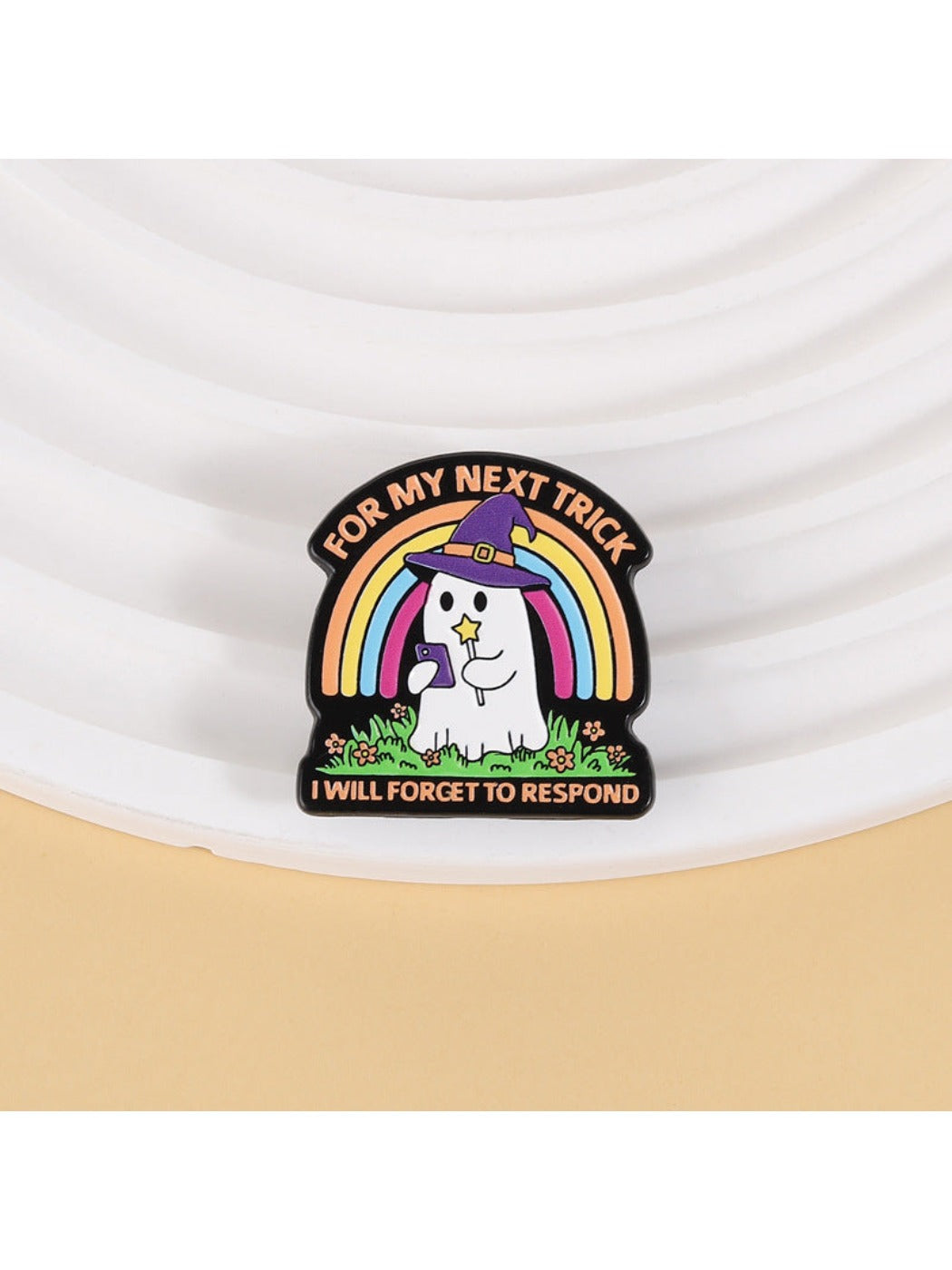 Close-up of Pinori Rainbow Ghost cute brooch showing detailed rainbow colors