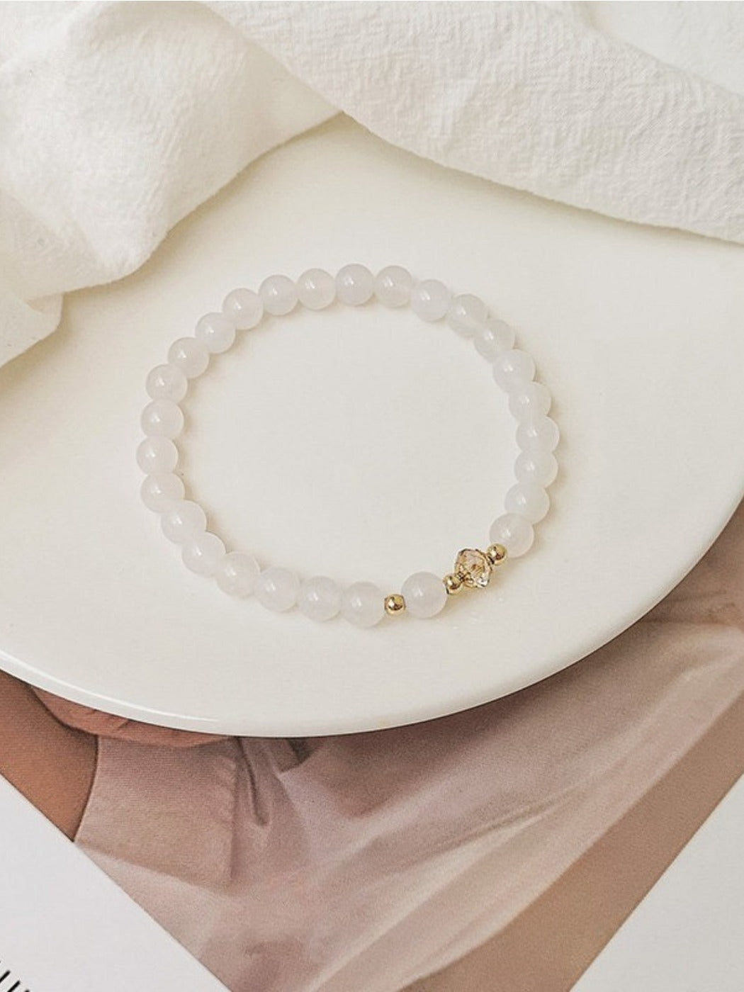 Detailed view of the clasp and crystal arrangement on the Emora white bracelet