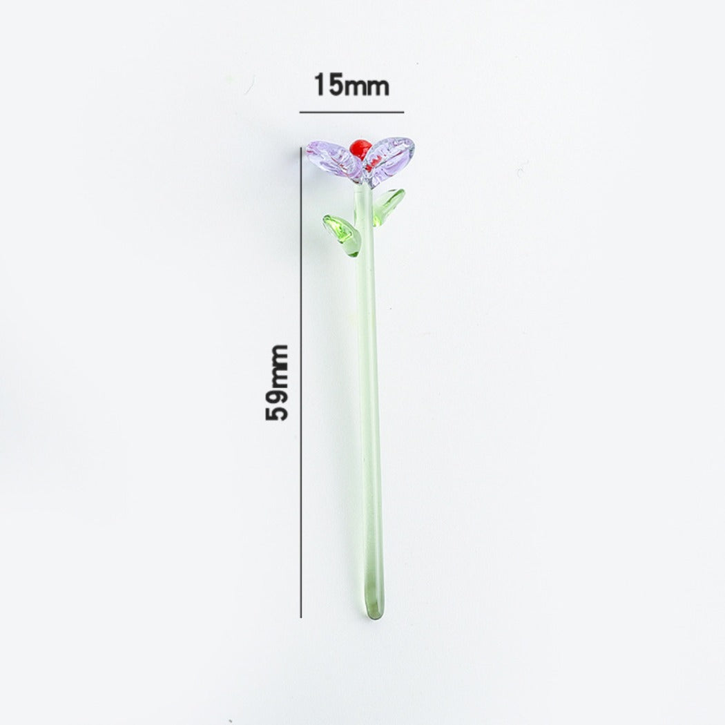 Hand holding Thimara Japanese cute mini glass daisy showing its delicate design