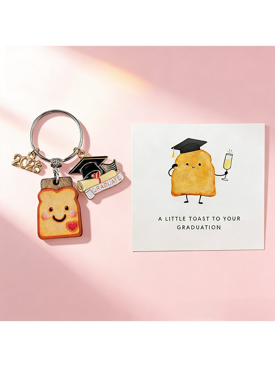Side view of Taphug resin bread cookie charm attached to graduation keychain